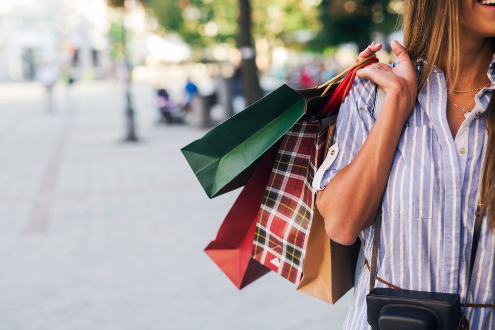 A woman shopping in Dover, Delaware using her debit card and checking account.