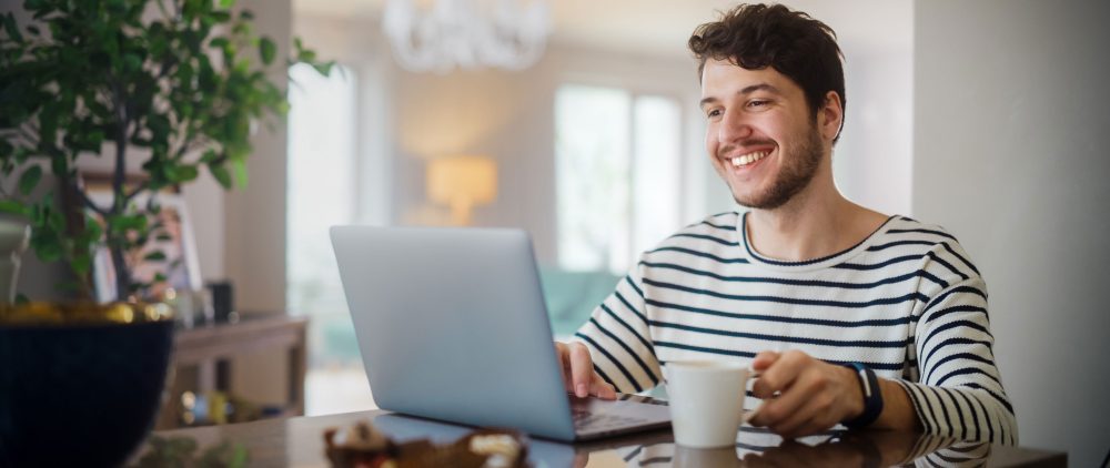 Man Using Laptop Computer for Online Banking