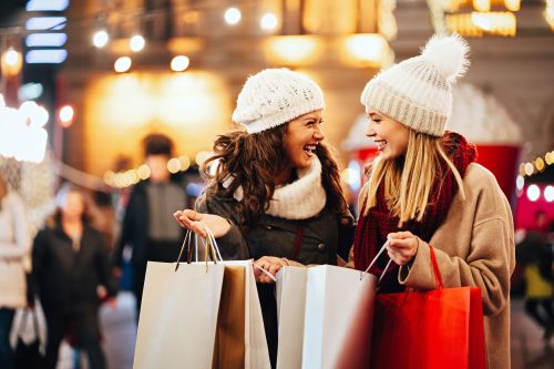 Happy women are shopping for presents during the holiday season