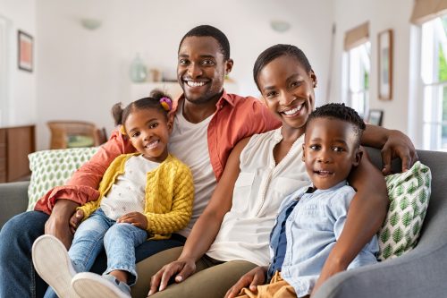 Portrait of happy African American family with son and daughter smiling